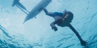 A young boy takes a dive into the ocean on A World Of Calm