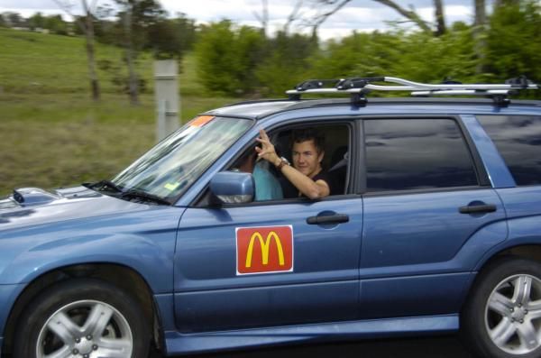 Heinrich Haussler waves from the judge's car.
