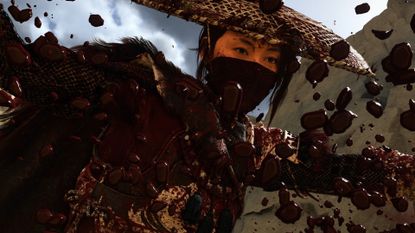 A closeup on Atsu's face as blood splatters as Atsu slays an enemy in Ghost of Yotei with Takashi Miike mode on