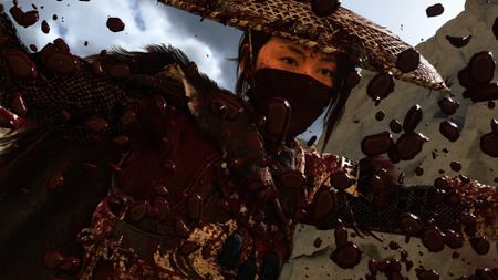 A closeup on Atsu's face as blood splatters as Atsu slays an enemy in Ghost of Yotei with Takashi Miike mode on