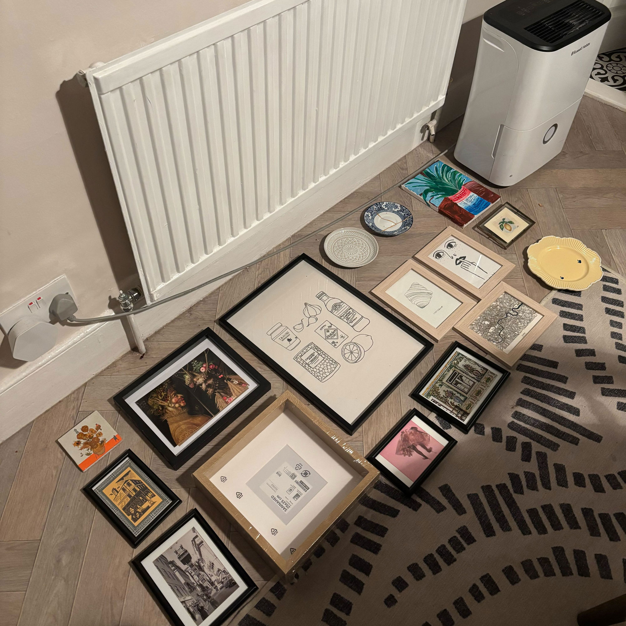 Frame and plates arranged on a vinyl kitchen floor