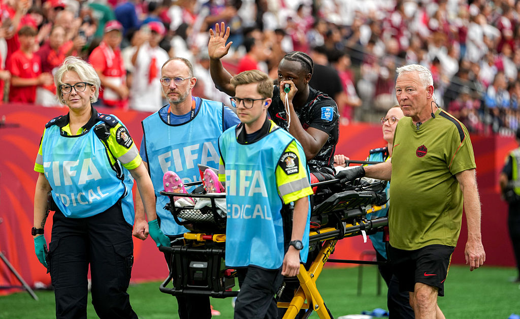 Canada's Ismael Kone had to go off on a stretcher