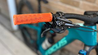 Orange ODI Reflex grip on bike handlebars