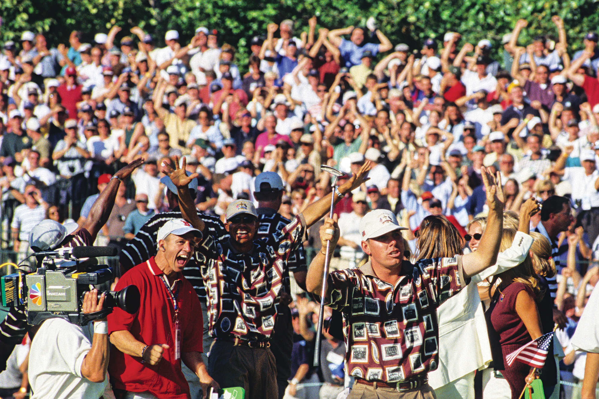 Ryder Cup crowds behind the USA team wearing shirts emblazoned with Ryder Cup nostalgia and memories