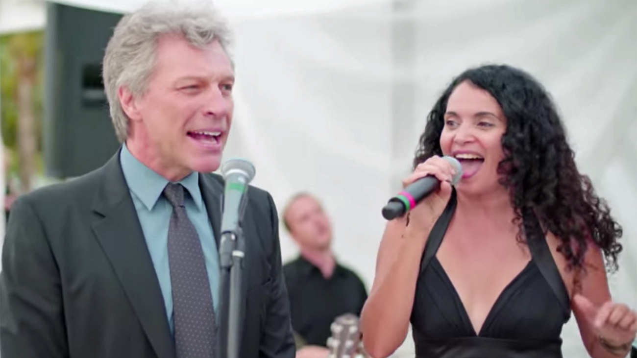 A picture of Jon Bon Jovi and Lourdes Valentin performing at a wedding in Miami