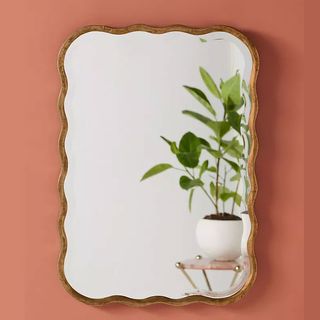Scalloped mirror with pink painted walls