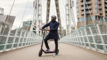 A person using an Eagle Electric Scooter