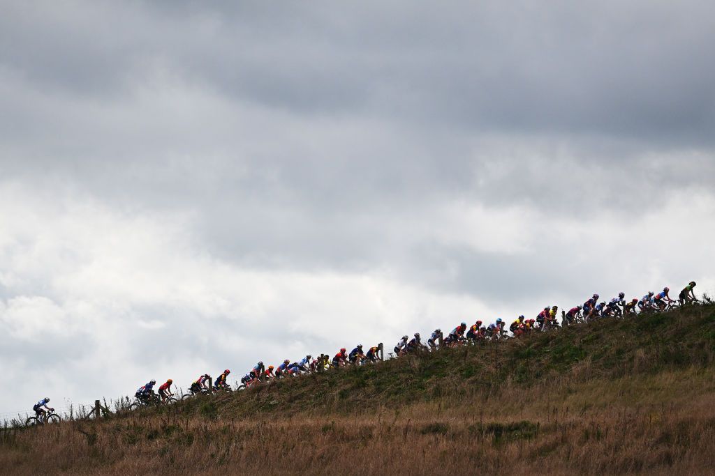 ASSEN NETHERLANDS OCTOBER 09 A general view of the peloton passing through a landscape during the 26th Simac Ladies Tour 2024 Stage 2 a 1548km stage from Coevorden to Assen on October 09 2024 in Assen Netherlands Photo by Luc ClaessenGetty Images