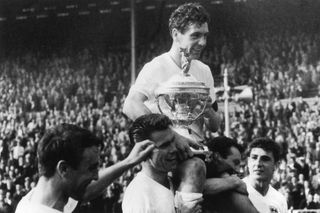 Members of the England team carry their captain, Johnny Haynes around Wembley Stadium after beating Scotland 9-3 in the Soccer International, 15th April 1961. Jimmy Greaves is visible on the extreme left. (Photo by Keystone/Hulton Archive/Getty Images)