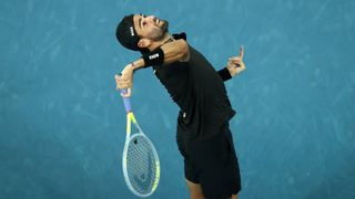 Matteo Berrettini of Italy serves in his singles match at the Australian Open 2022
