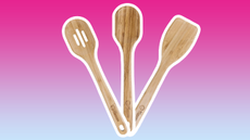 Three wooden utensils on a gradient background