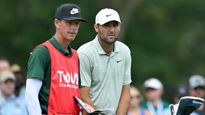 Ted Scott and Scottie Scheffler in conversation during the fourth round of the Tour Championship