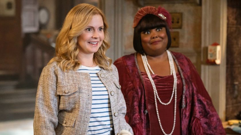 Pictured (L-R): Rose McIver as Sam smiling and Danielle Pinnock as Alberta standing behind her almost smiling.