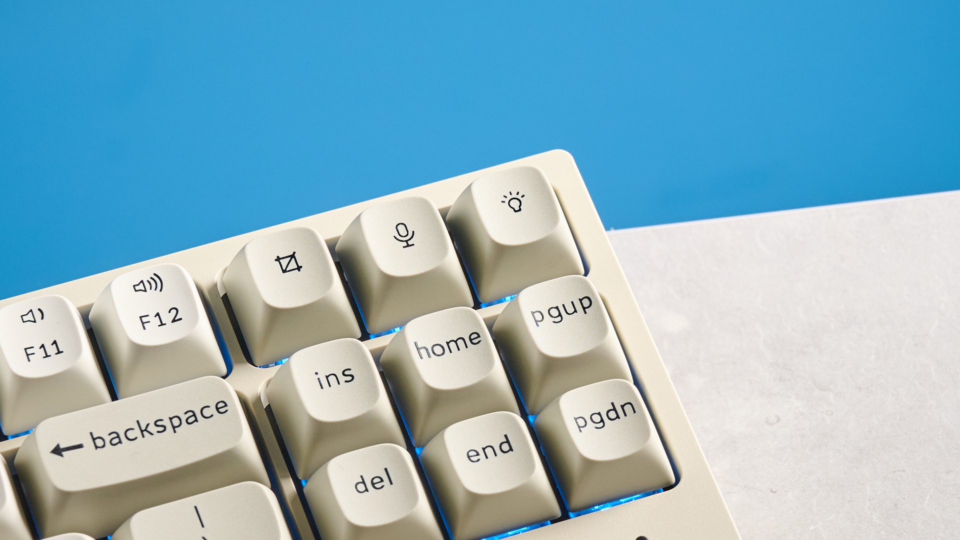 Keychron C1 Pro 8K photographed in front of a blue background.