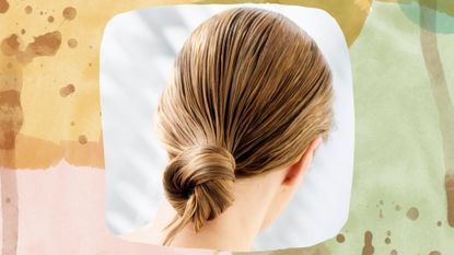 A woman with her wet hair wrapped in a knot, one of the ways how to straighten hair without heat