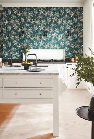 white kitchen with teal wallpaper