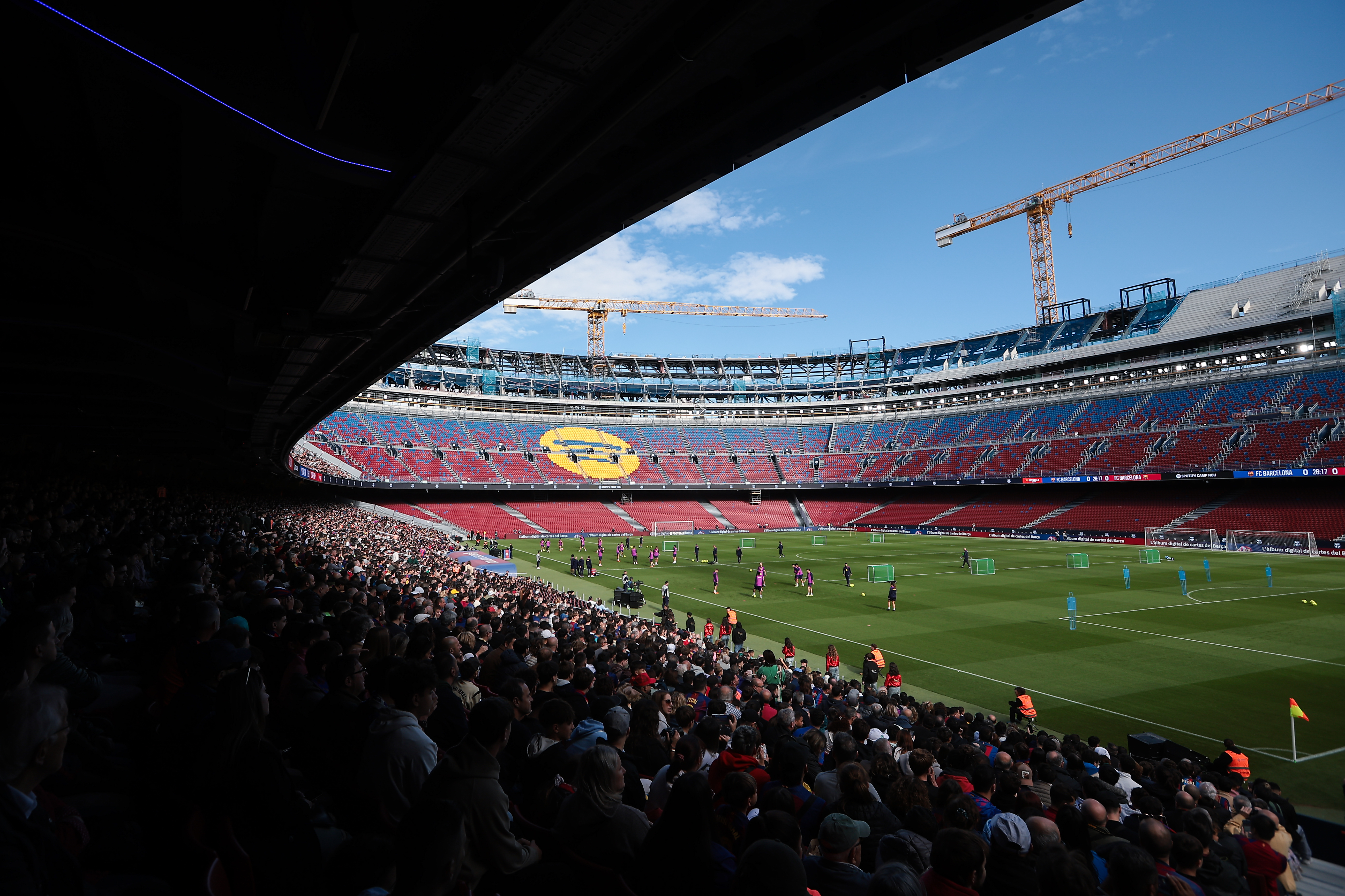BARCELONA, SPAIN - NOVEMBER 07: Fans of FC Barcelona follows the training session during their first FC Barcelona open training session at Spotify Camp Nou. 23,000 fans will watch Barcelona play during a sold-out open door training session at the new Spotify Camp Nou today, as the stadium reopens following it&amp;apos;s closure for refurbishment on May 28, 2023, on November 07, 2025 in Barcelona, Spain. (Photo by Eric Alonso/Getty Images)