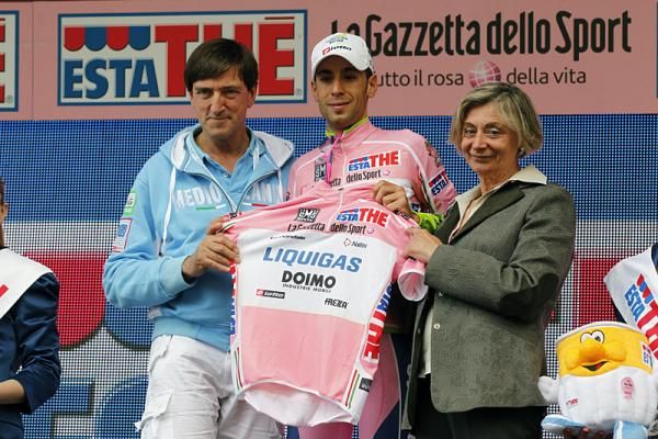 Vincenzo Nibali (Liquigas - Doimo) is presented with the leader's jersey by Fausto Coppi's children, Faustino and Marina.