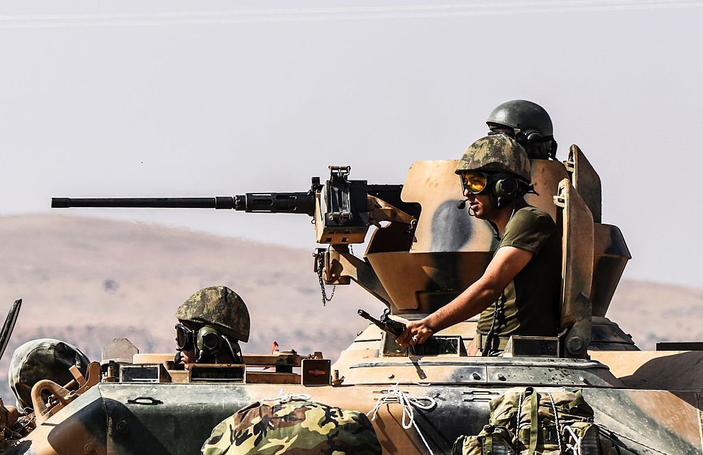 Turkish soldiers on a tank going to Syria