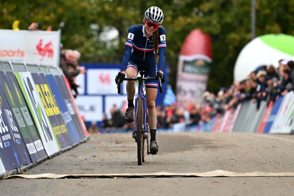 NAMUR BELGIUM NOVEMBER 06 Line Burquier of France celebrates crossing the finish line on second place during the 20th UEC European Cyclocross Championships 2022 Womens U23 EuroCross22 on November 06 2022 in Namur Belgium Photo by Luc ClaessenGetty Images