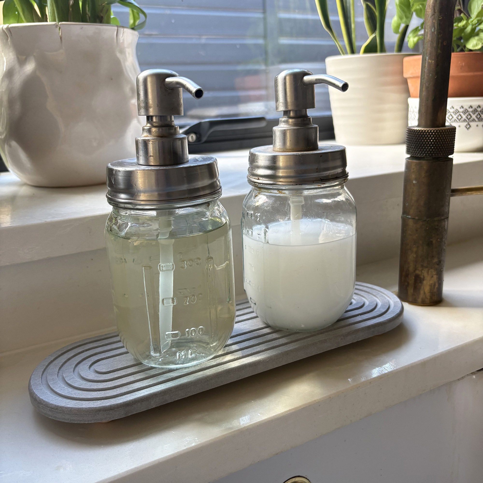 Stone sink caddy in kitchen