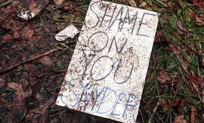 A trampled sign lies on the ground after a rally to protest Michigan's new right-to-work law.