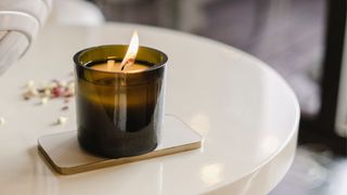 picture of scented candle burning on table