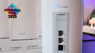 A close-up, cropped photo of a TP-Link Deco BE68 mesh router, with its retail box partially visible in the background, and a PC Gamer Personal Pick 2025 logo in the top left corner.