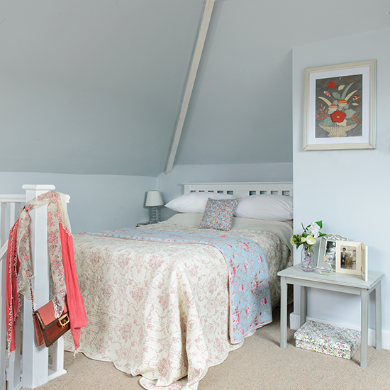 bedroom with blue wall and bed
