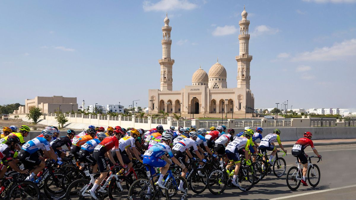 The peloton passes the Sultan Qaboos Grand Mosque in Muscat during stage 6 of the 2022 Tour of Oman Photo by THOMAS SAMSONAFP via Getty Images