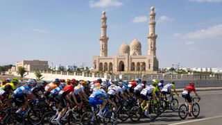 The peloton passes the Sultan Qaboos Grand Mosque in Muscat during stage 6 of the 2022 Tour of Oman Photo by THOMAS SAMSONAFP via Getty Images