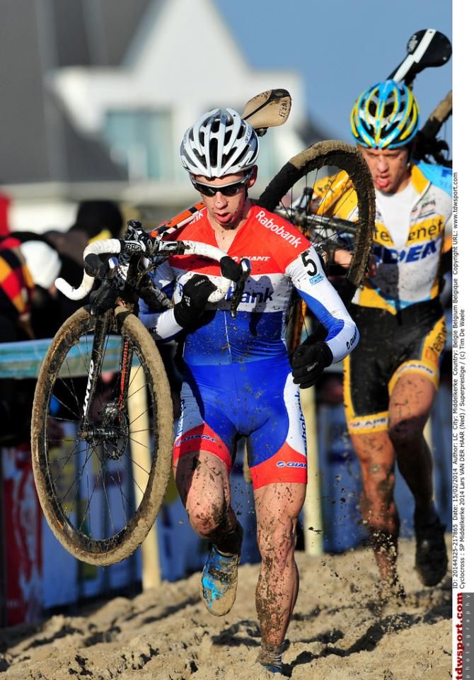Lars Van Der Haar shoulders his bike