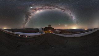 The arc of the Milky Way galaxy shimmers over the La Silla Observatory in Chile in this gorgeous night-sky view by European Southern Observatory (ESO) photo ambassador Petr Horálek. In the center of the image is the ESO 3.6-metre telescope, and to its left is the Swiss 1.2-metre Leonhard Euler telescope. Visible beneath the righthand limb of the Milky Way's starry arc are the Large and Small Magellanic Clouds, two satellite galaxies of the Milky Way. Saturn is visible under the left side of the arc, with Jupiter glowing brightly just above it and slightly to the left.