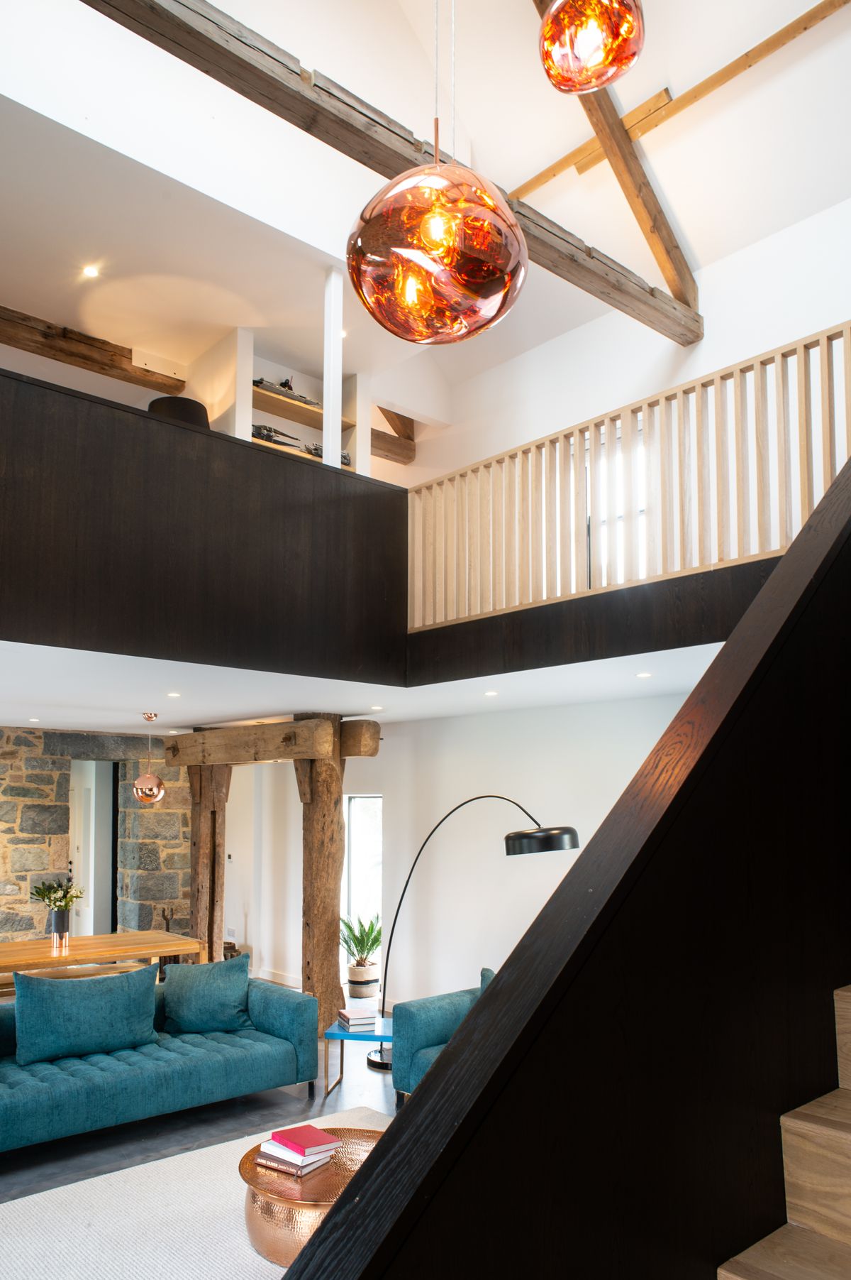 mezzanine area in barn conversion with pendant light