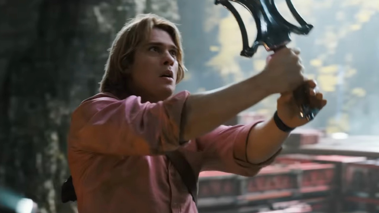 Nicholas Galitzine looking at a sword in Masters of the Universe.