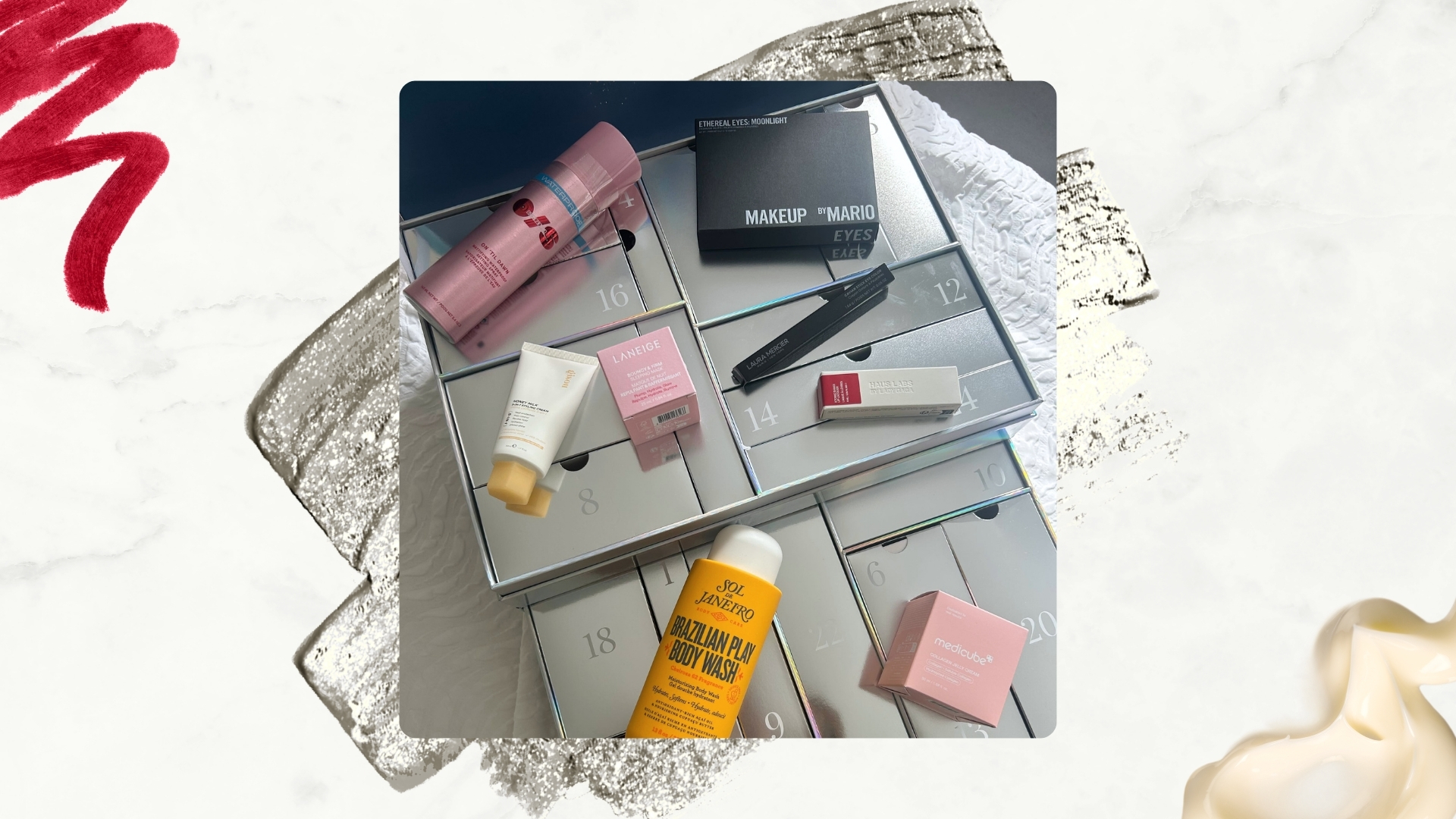 Image of the Sephora Favorites Advent Calendar with its contents on top, on a white marble background with silver glitter swatch, cream and red lip liner swatches