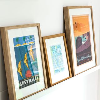 framed pictures on picture ledge