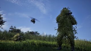 Wardogs two players dressed in ghillie suits as a small helicopter approaches from behind