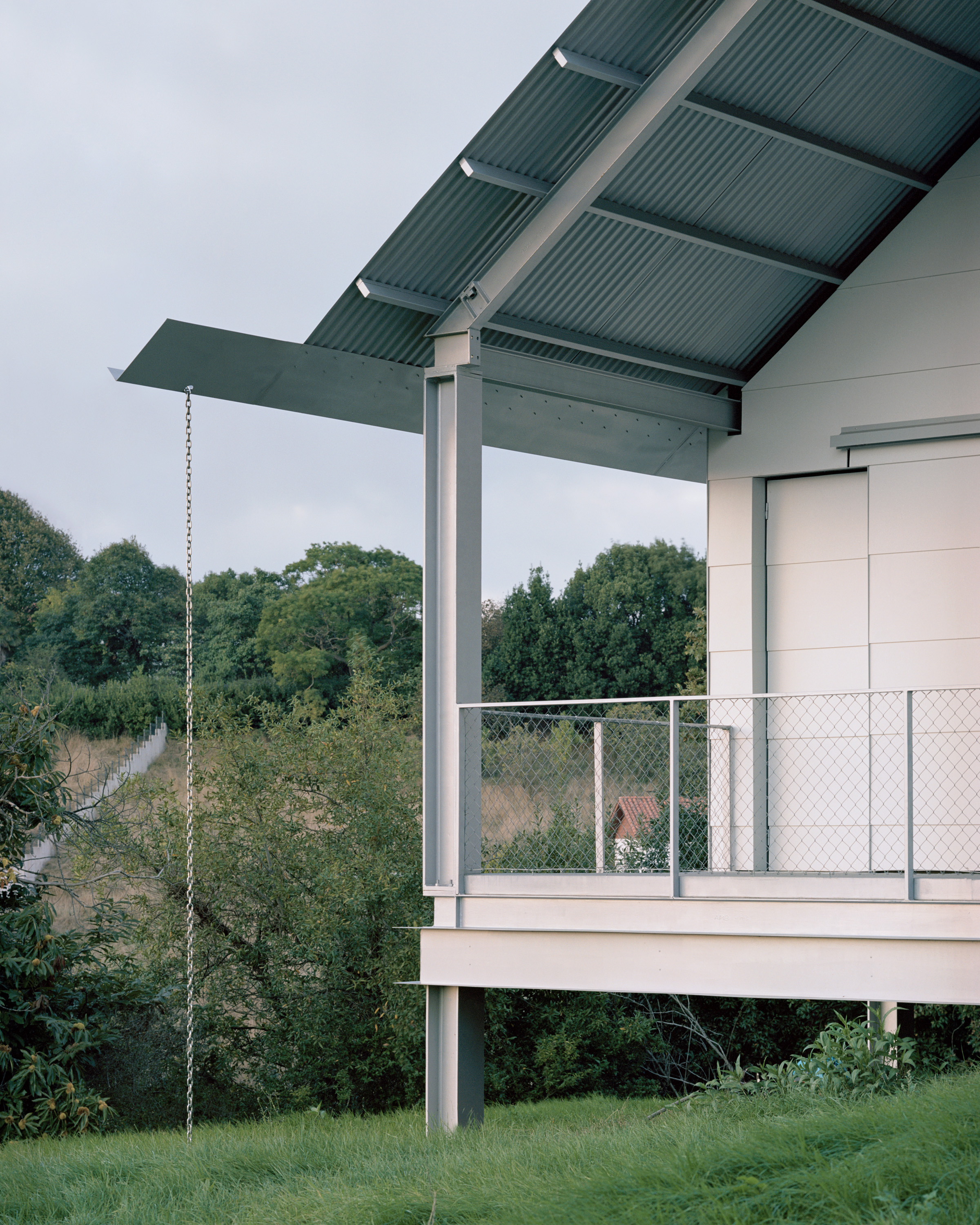 view of minimalist Casa Guadalupe by studio hanghar, a white house with dark timber accents