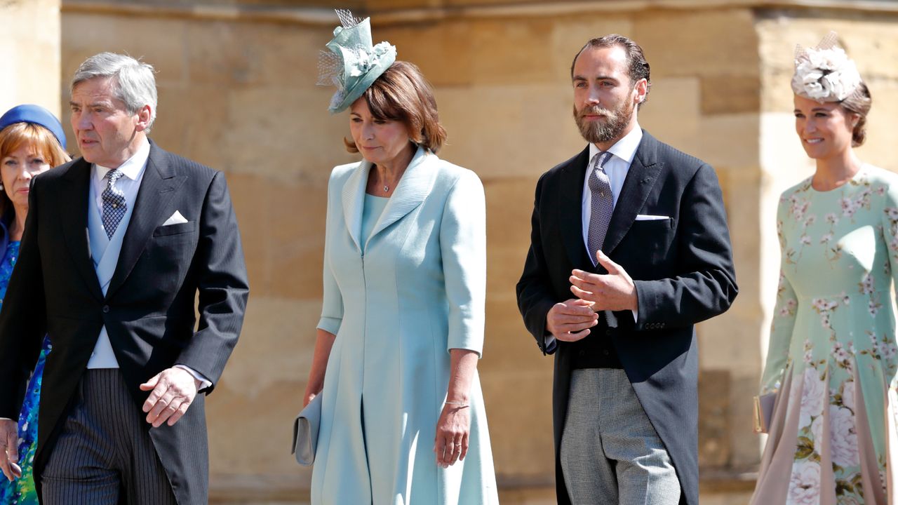 Carole, James and Pippa Middleton walking into Prince Harry and Meghan Markle&#039;s wedding wearing dress clothes