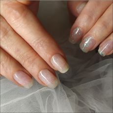 close-up of spring nail colors on a woman's hand