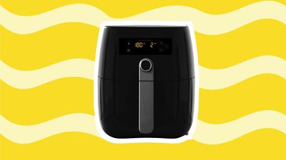 An air fryer on a yellow wavy background