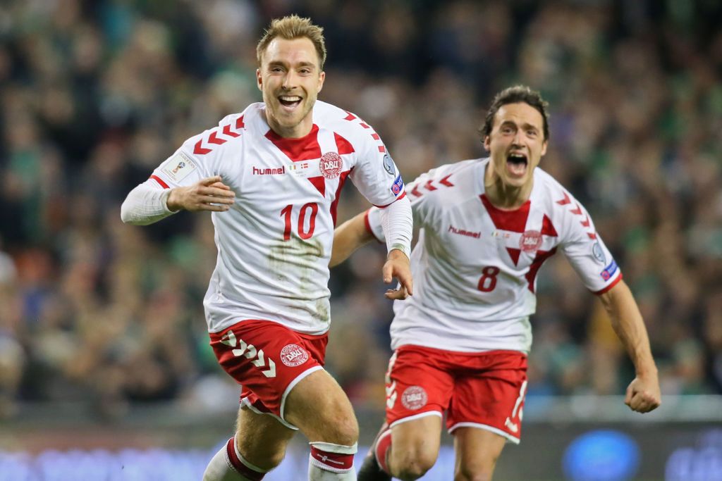 Denmark&#039;s midfielder Christian Eriksen celebrates with Denmark&#039;s midfielder Thomas Delaney (R) after scoring their third goal during the FIFA World Cup 2018 qualifying football match, second leg, between Republic of Ireland and Denmark at Aviva Stadium in Dublin on November 14, 2017.