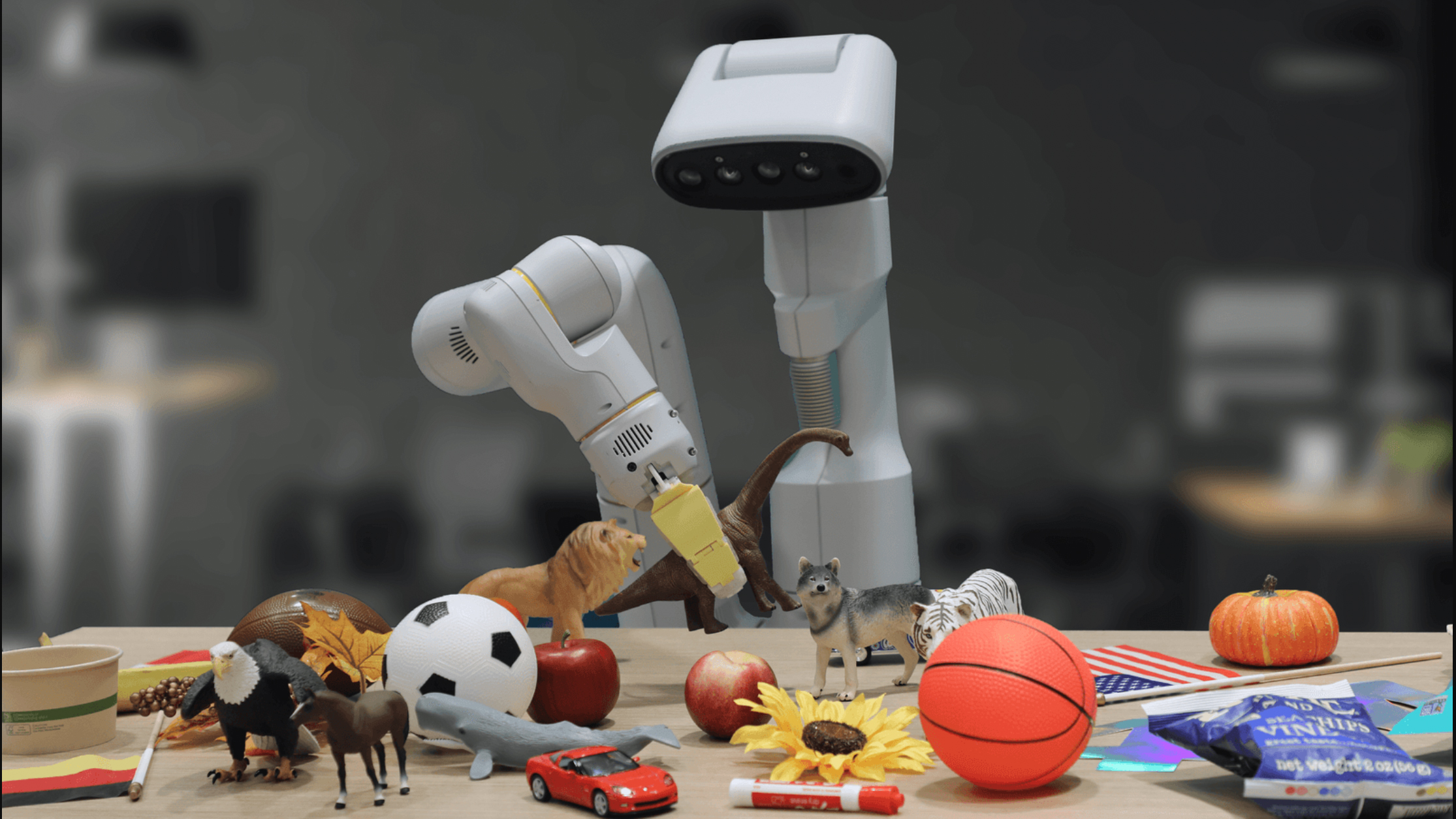 A robot looking at a table of toys