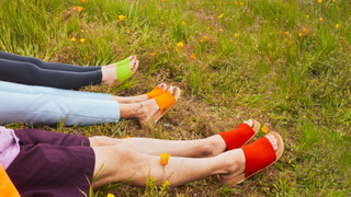 women wearing Message slides in lime green, orange, and red