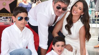 Simon Cowell, Lauren Silverman, Eric Cowell and Adam Silverman attend the ceremony honoring Simon Cowell with star on the Hollywood Walk of Fame on August 22, 2018 in Hollywood, California
