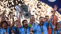 Manchester City FC lifts the trophy as the teammates celebrate