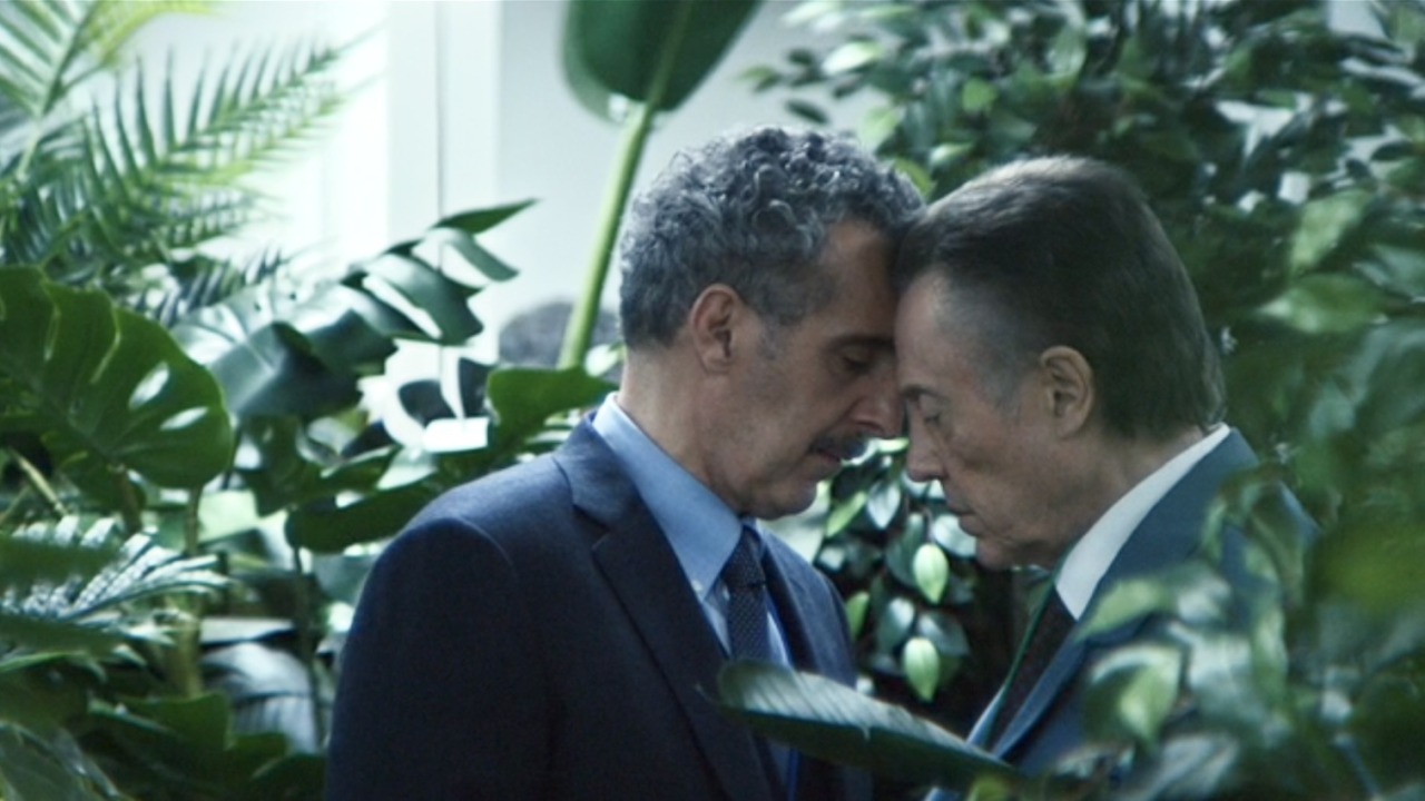 John Turturro and Christopher Walken as Burt and Irving, touching their foreheads together