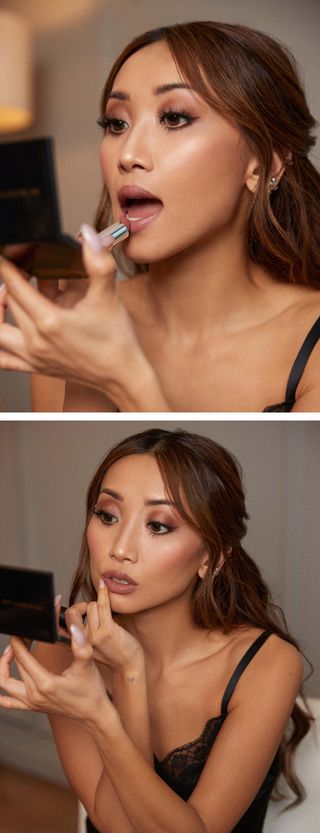 Brenda Song applies her makeup for her red carpet premiere with a handheld compact mirror