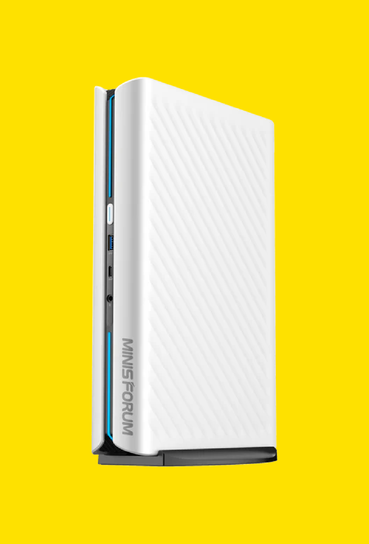 A Minisforum AtomMan mini PC on a yellow background.